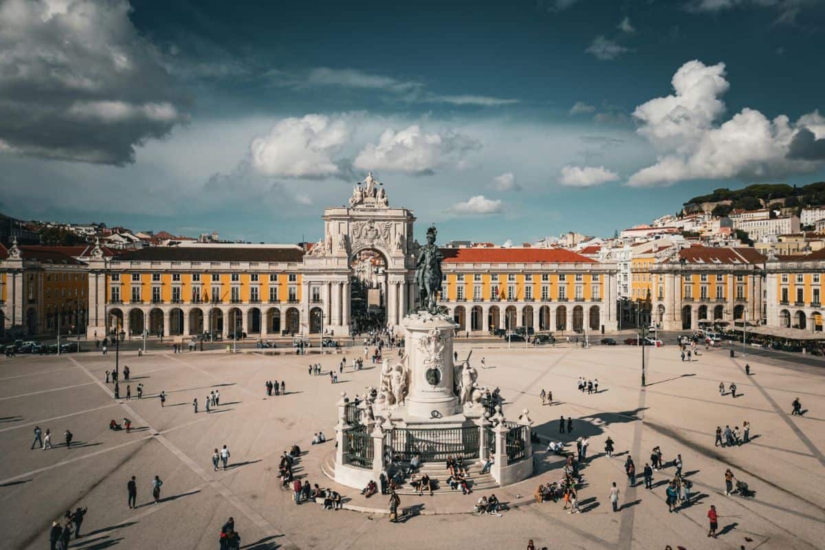 View of Praça do Comércio in Lisbon, featuring the grand Arco da Rua Augusta and a central equestrian statue, a must-see stop on any Lisbon Itinerary.