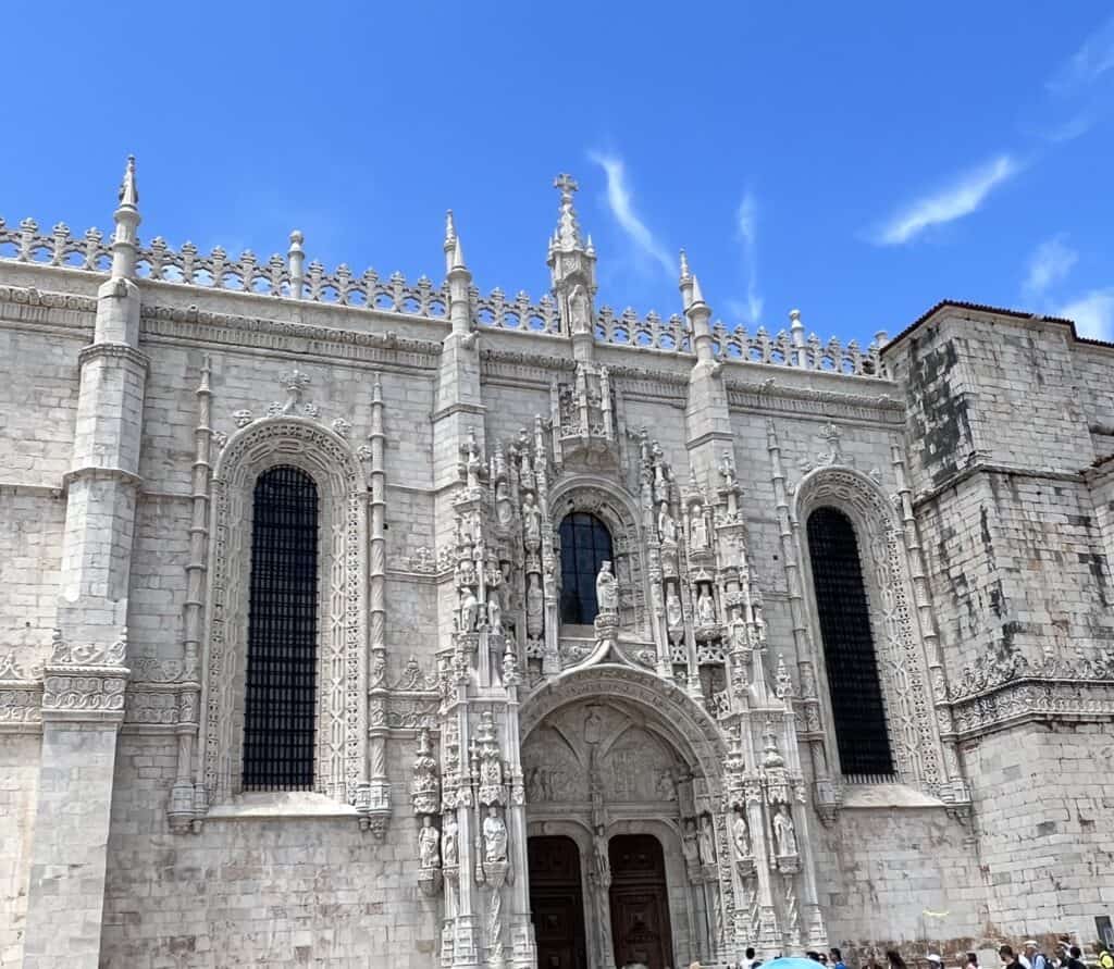 The ornate Manueline façade of Jerónimos Monastery in Belém, a UNESCO World Heritage site that’s a highlight of any well-planned Lisbon itinerary.