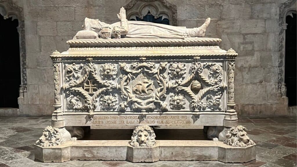 Ornately carved white stone tomb of Vasco de Gama inside Jerónimos Monastery resting on sculpted lions and decorated with maritime symbols. The monument reflects Portugal’s Age of Discovery Lisbon heritage.