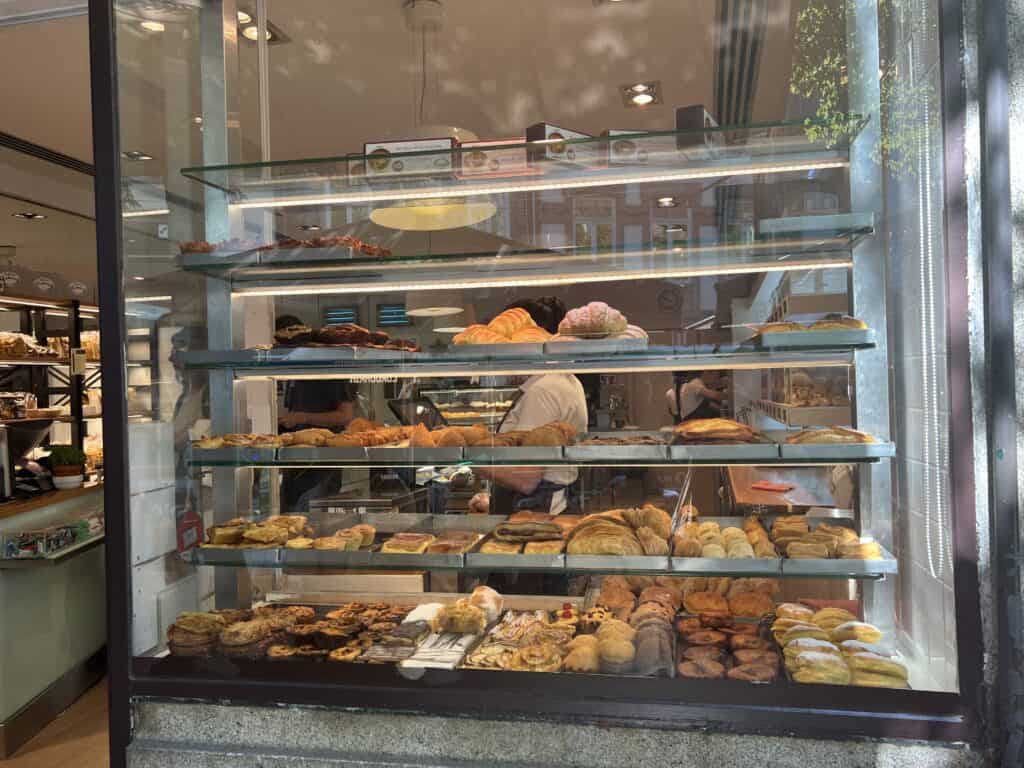 Window full of pastries at the Bakery Padaria Ribeira in Porto.