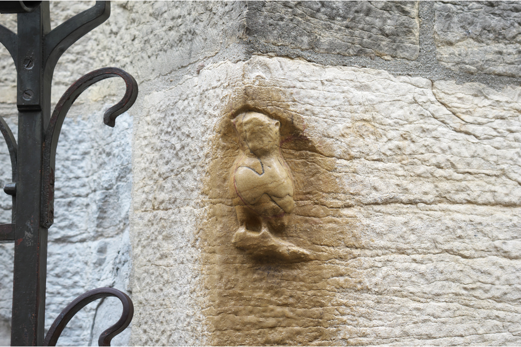 Weathered stone owl carving on Notre-Dame Church along the Owl Trail in Dijon Burgundy